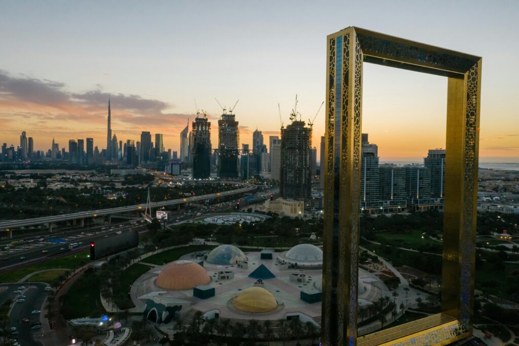 Stunning Dubai skyline featuring the iconic Dubai Frame during sunset with clear city views.